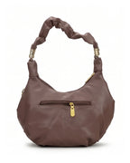 Brown handbag with gold accents on a white background